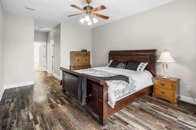 a workspace with wooden floor and windows