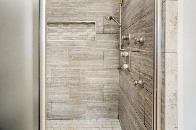 a view of a big house with a big yard and large trees