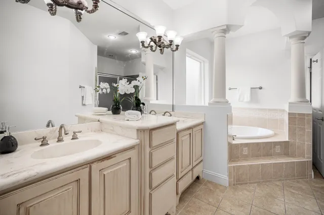 a front view of a house with a garden and yard