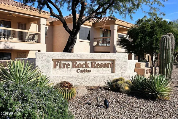 a view of a white house with a outdoor space