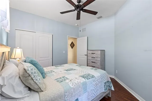 a bathroom with a granite countertop sink toilet a mirror and shower