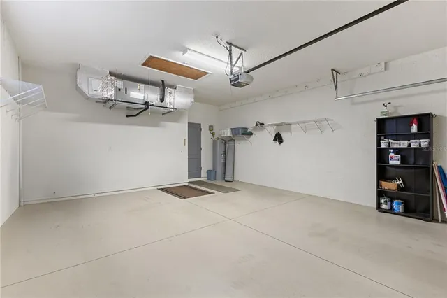 an aerial view of a house with a big yard