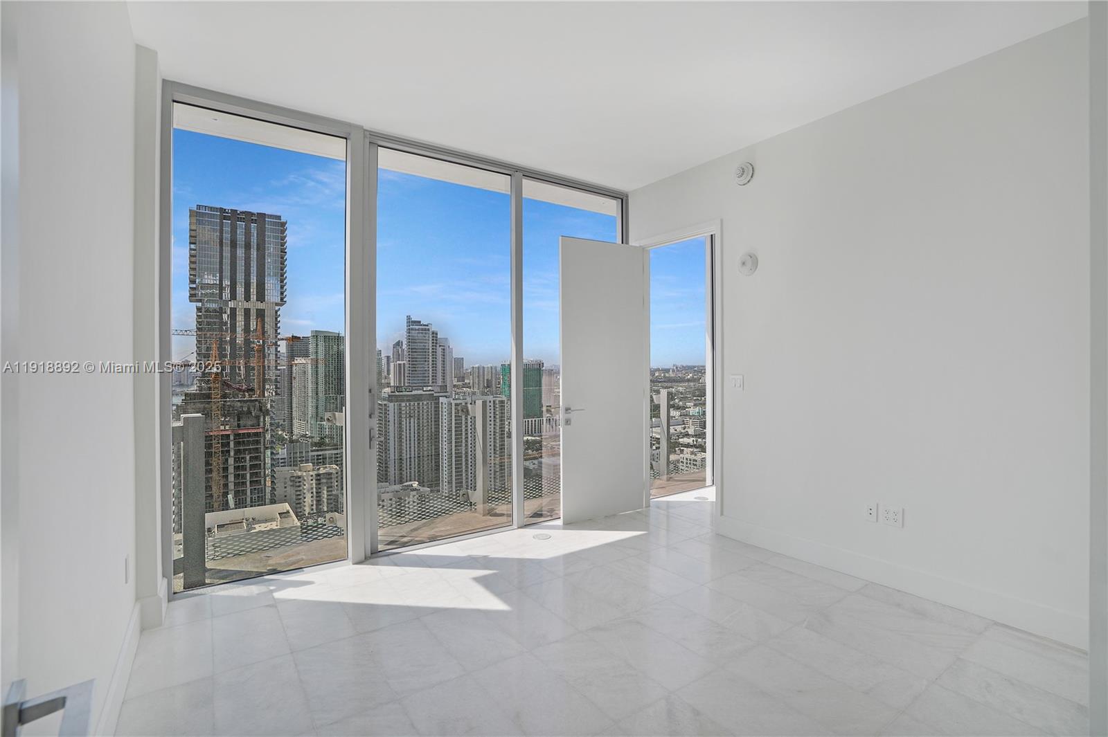700 Northeast 26th Terrace, Unit 3604 Miami, FL 33137 - Photo 14 of 35 a view of livingroom with floor to ceiling window