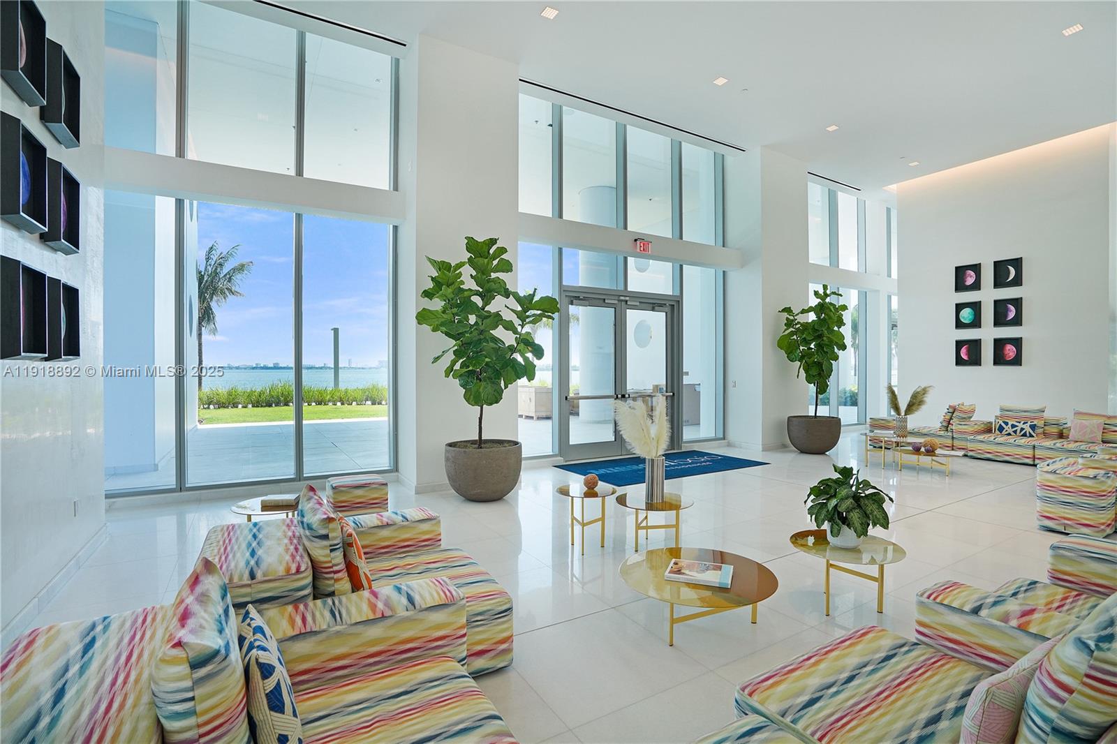 700 Northeast 26th Terrace, Unit 3604 Miami, FL 33137 - Photo 21 of 35 a living room with furniture and a floor to ceiling window