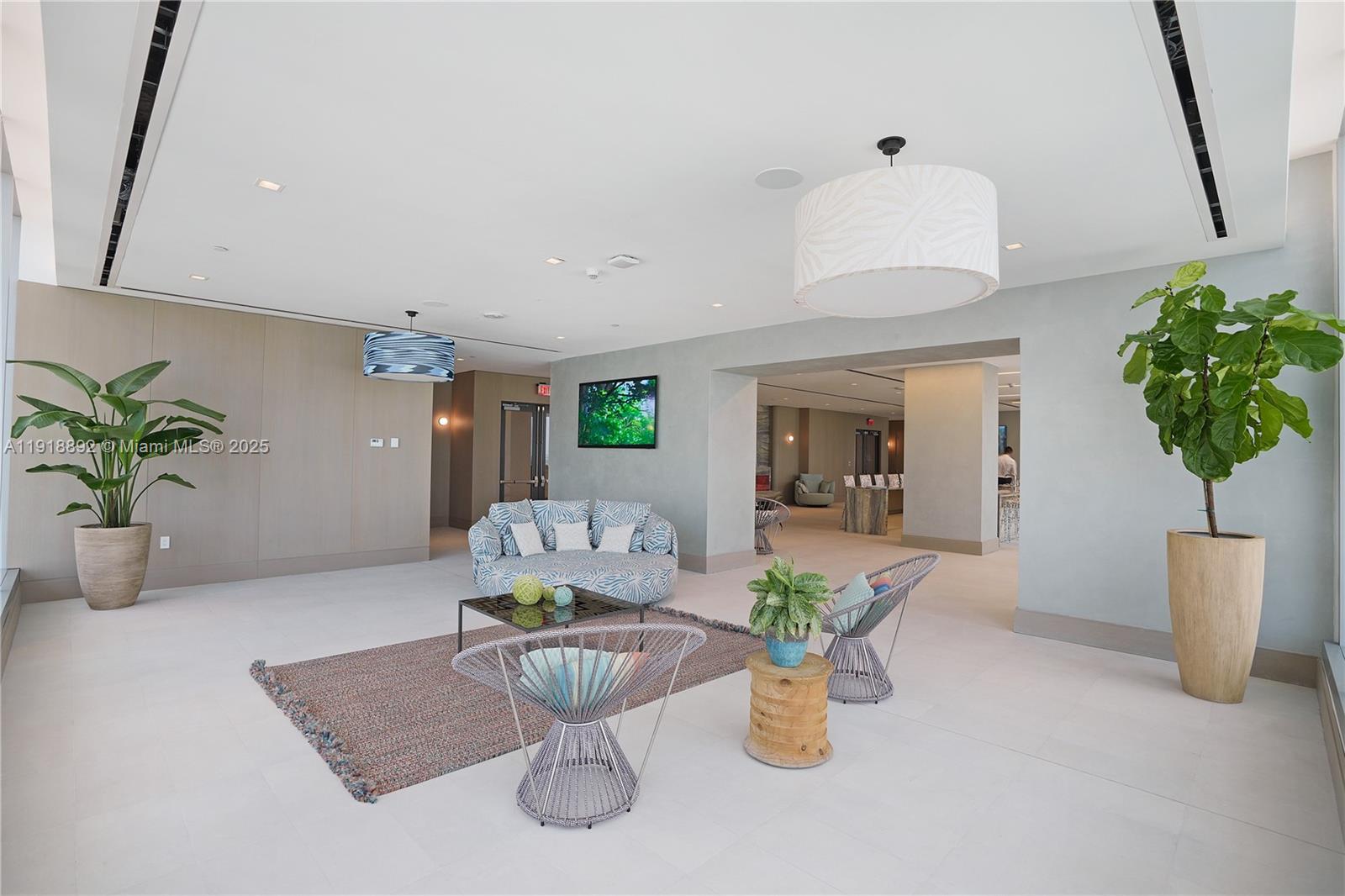 700 Northeast 26th Terrace, Unit 3604 Miami, FL 33137 - Photo 24 of 35 a living room with furniture and a potted plant