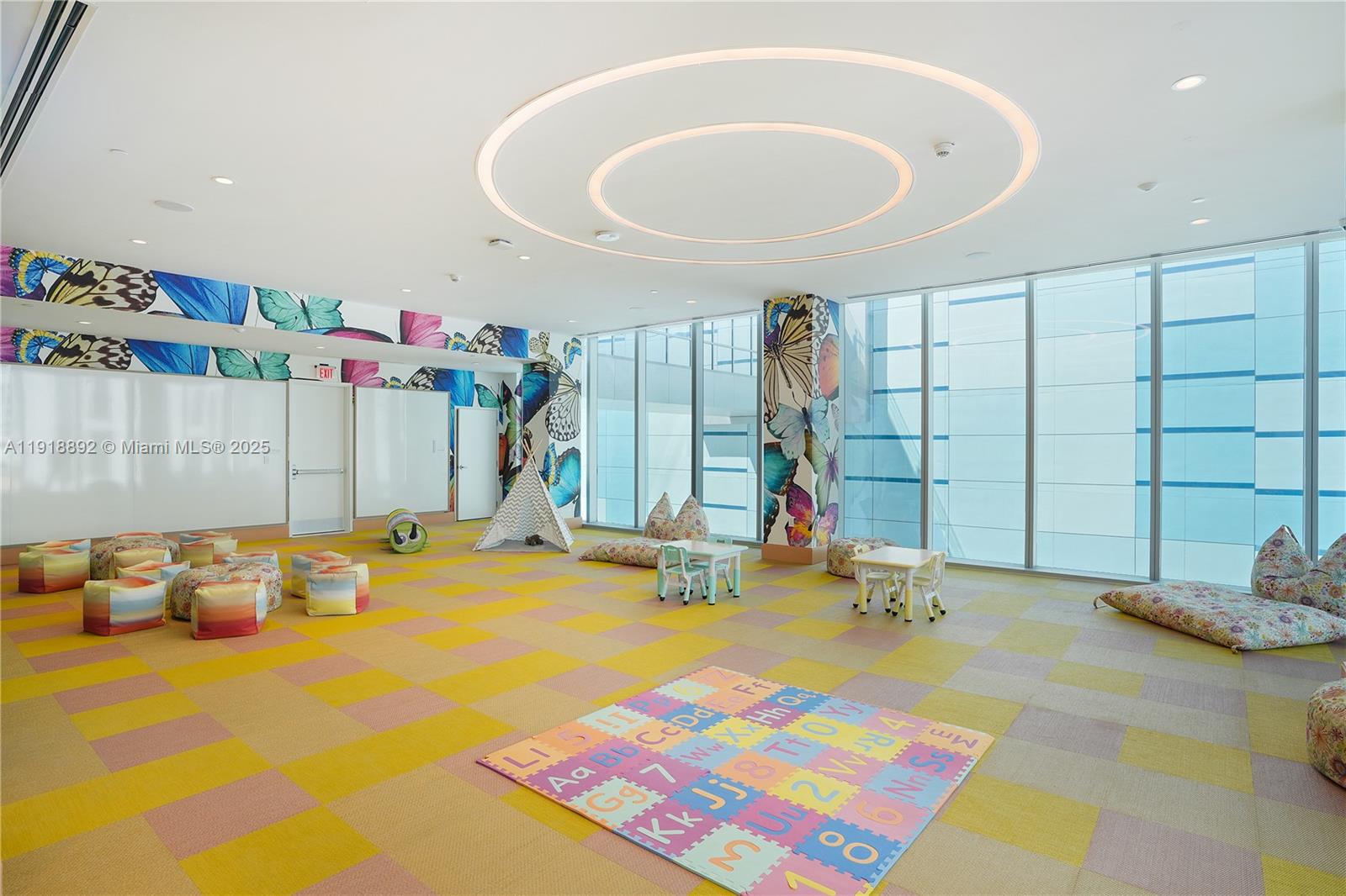 700 Northeast 26th Terrace, Unit 3604 Miami, FL 33137 - Photo 33 of 35 a room with gym equipment and a table