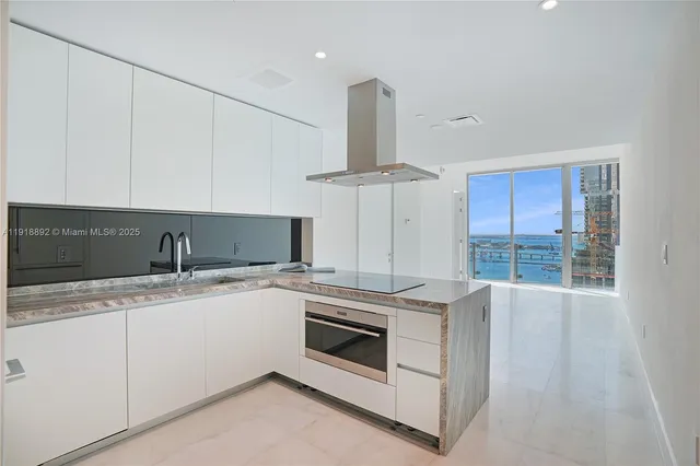 a view of a kitchen with washer and dryer