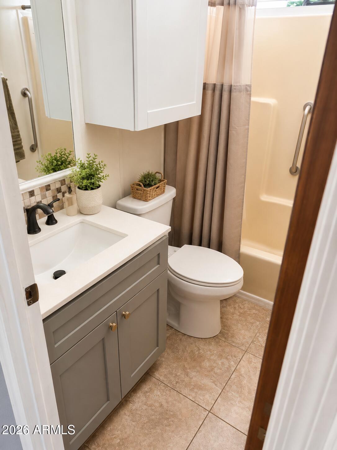 3330 East Main Street, Unit 332 Mesa, AZ 85213 - Photo 7 of 12 a bathroom with a sink toilet and shower