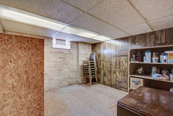 a view of a house with a backyard and sitting area