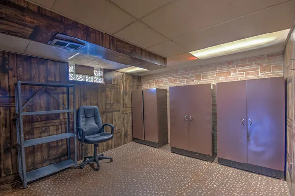 a view of a house with a yard and sitting area