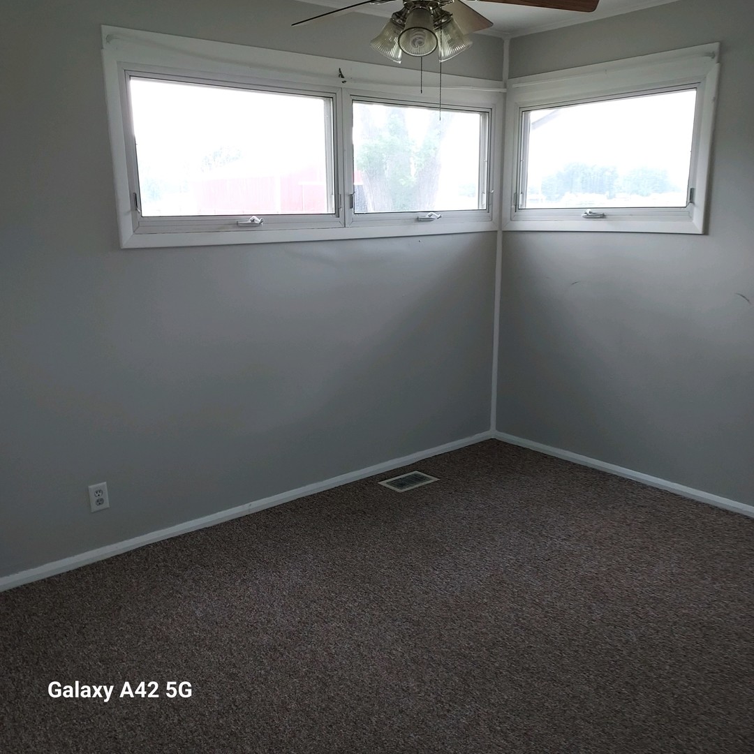 508 East North Line Road Tuscola, IL 61953 - Photo 9 of 12 a view of an empty room with a window