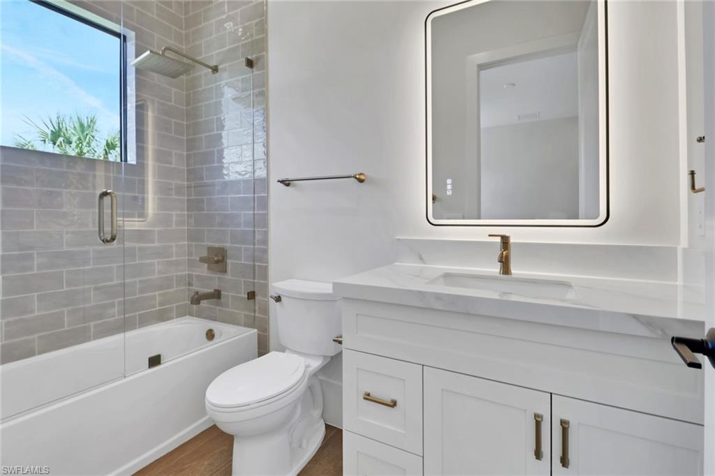 538 13th Street Southwest Naples, FL 34117 - Photo 17 of 25 a bathroom with a sink toilet a shower and bathtub