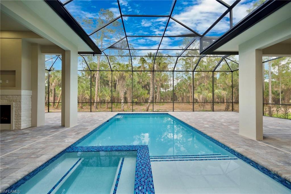 538 13th Street Southwest Naples, FL 34117 - Photo 21 of 25 a swimming pool with large glass door