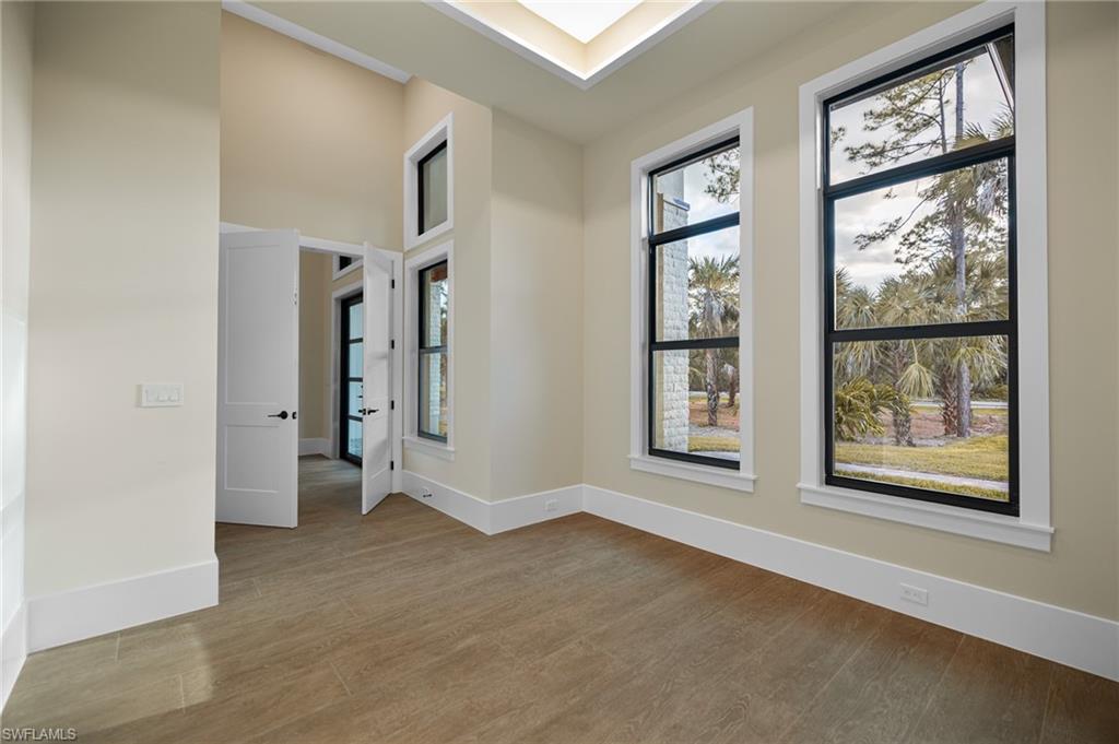 538 13th Street Southwest Naples, FL 34117 - Photo 6 of 15 an empty room with windows and closet