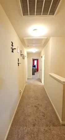 a view of empty room with a fireplace