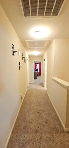 a view of empty room with a fireplace