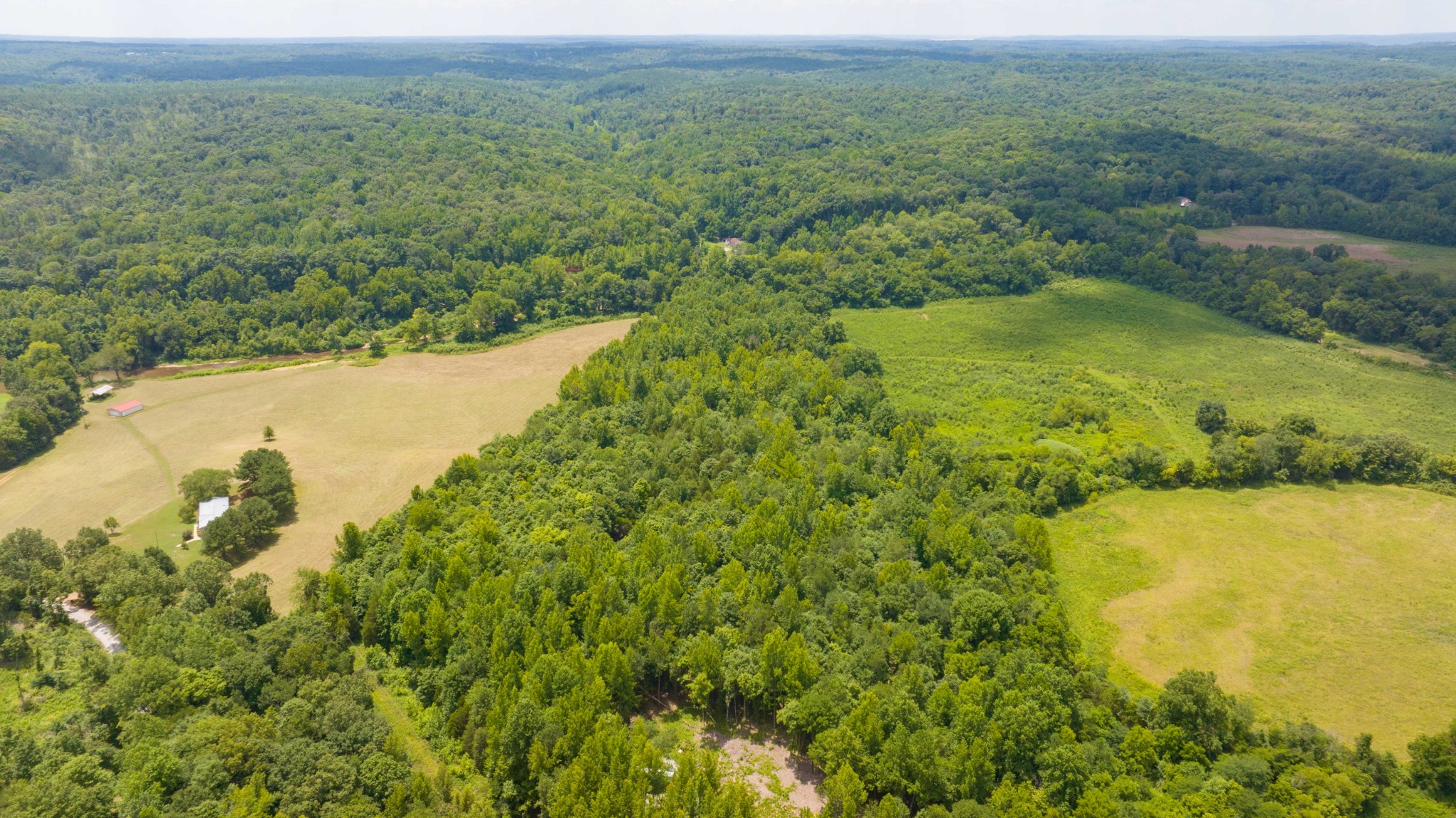 433 Sid Summers Road Stewart, TN 37175 - Photo 49 of 66 a view of a lake with a mountain in the background