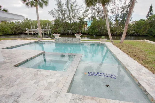 a view of a swimming pool with a patio