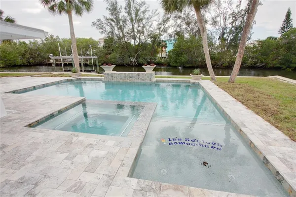a view of a swimming pool with a patio