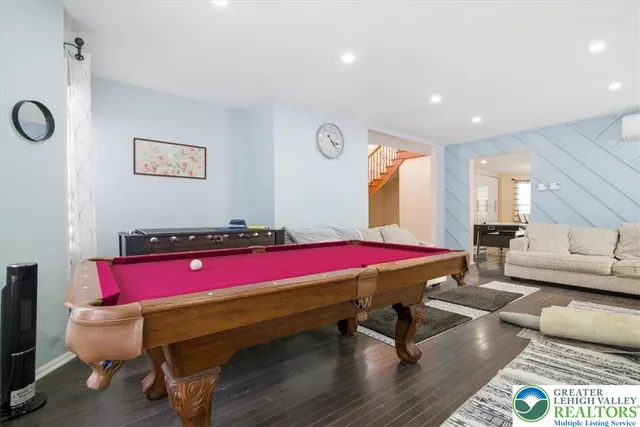 a kitchen with stainless steel appliances granite countertop a stove a sink and white cabinets