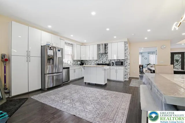 a spacious bedroom with a large bed and a large window