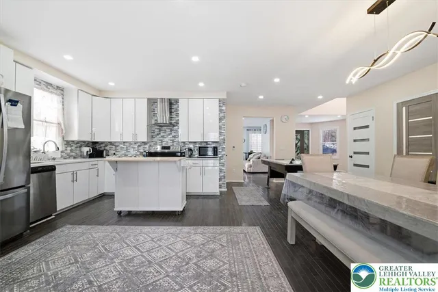 a spacious bedroom with a bed and window