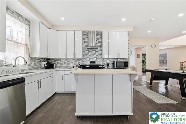 a bedroom with a bed and a ceiling fan