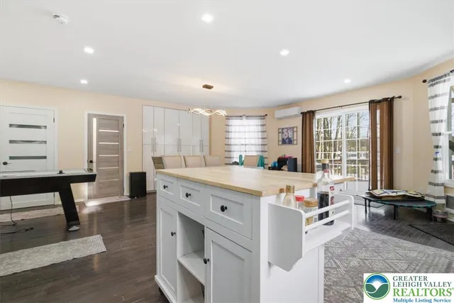a view of a room with wooden floor and windows