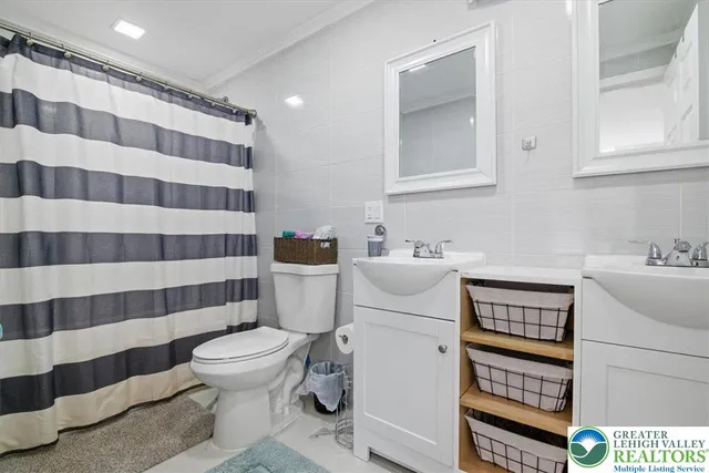 a bedroom with a bed and a painting