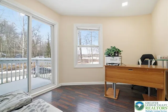 a bedroom with a bed and flat screen tv