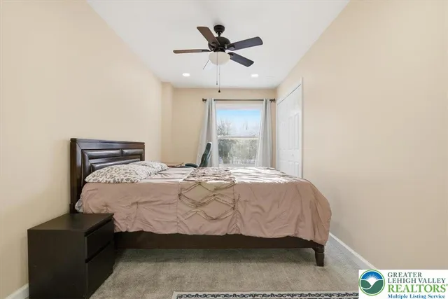 a bathroom with a sink toilet and window