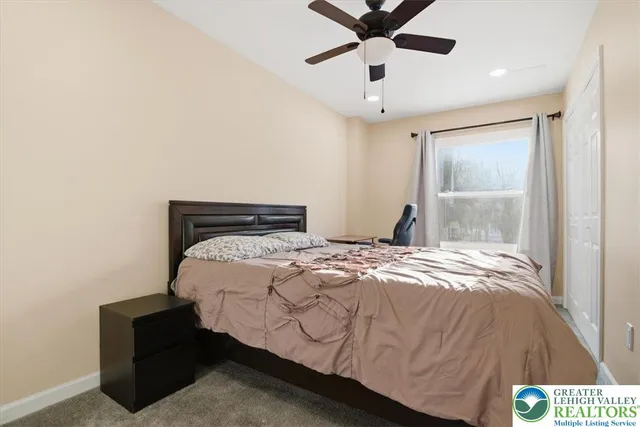 a bathroom with a sink a mirror and shower