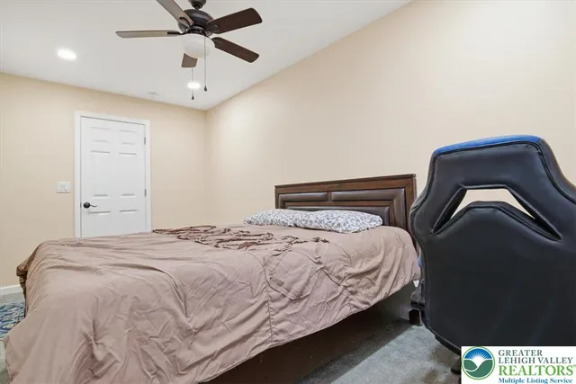 a view of a roof deck with couches and wooden floor