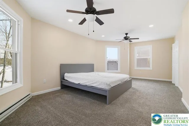 a front view of a house with a yard and furniture