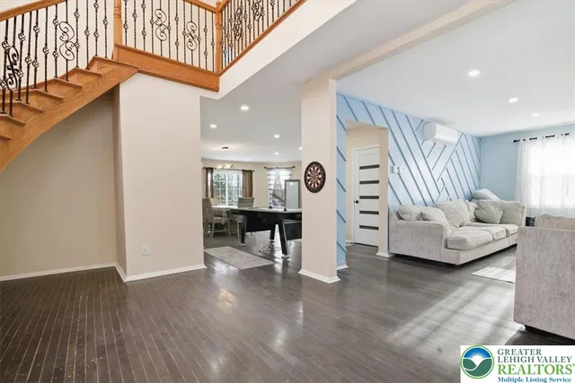 a living room with furniture a table and a window