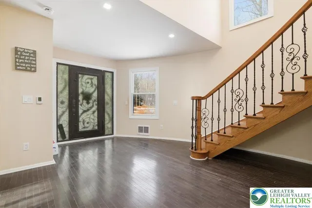 a living room with fireplace furniture and a flat screen tv