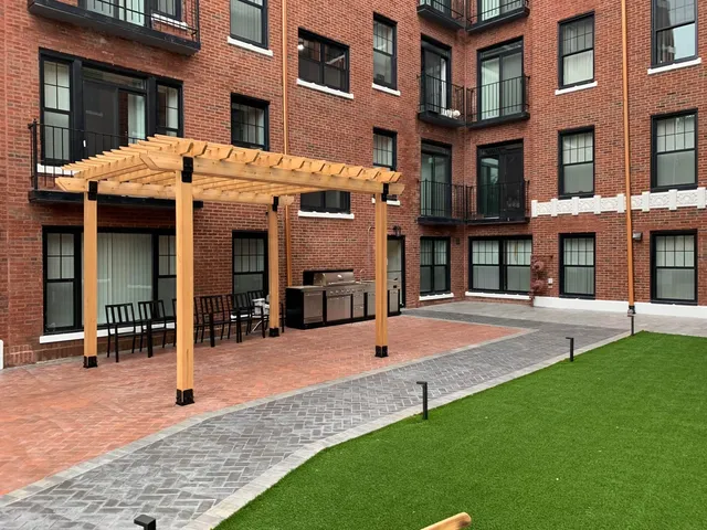 a view of a building with a yard