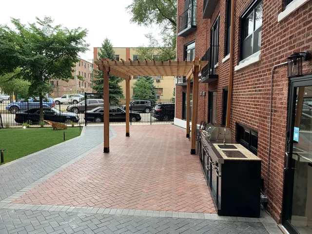 a view of a patio with a yard