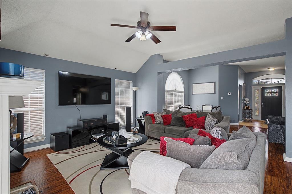 645 Cross Ridge Circle Fort Worth, TX 76120 - Photo 15 of 26 Living room with wood finished floors, lofted ceiling, and ceiling fan