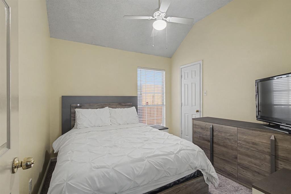 645 Cross Ridge Circle Fort Worth, TX 76120 - Photo 21 of 26 Bedroom with ceiling fan and baseboards