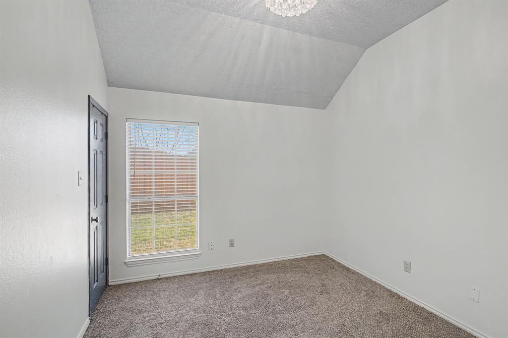 645 Cross Ridge Circle Fort Worth, TX 76120 - Photo 24 of 26 Secondary bedroom with carpet flooring and hanging lights