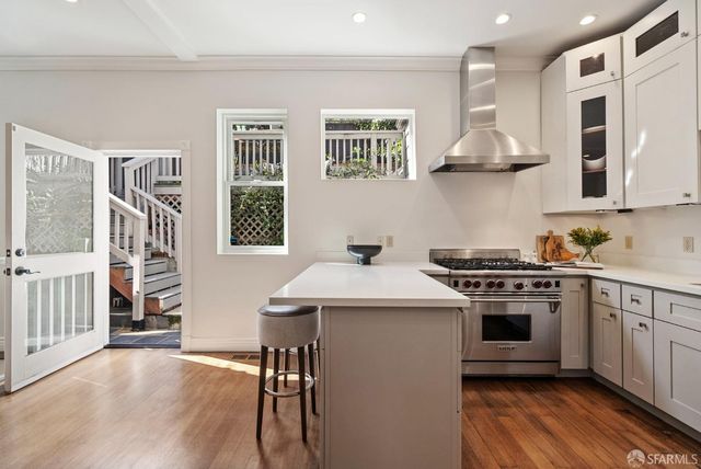 a view of a chair and tables in the patio