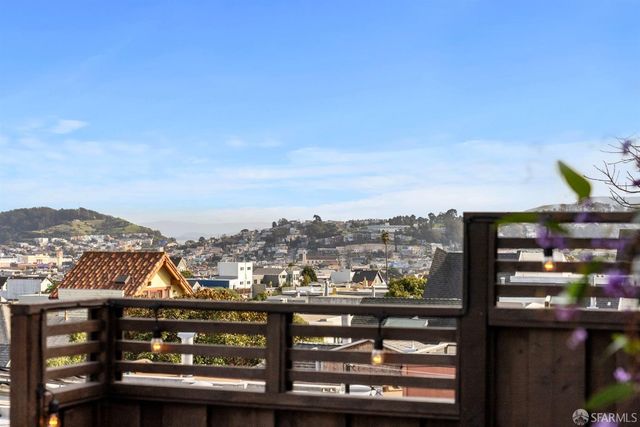 a view of a backyard with sitting area