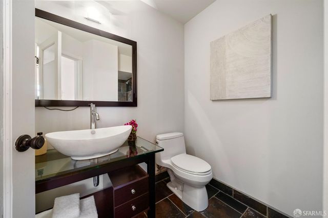 a en suite bathroom with a sink a mirror and a bathtub