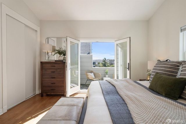 a front view of a residential apartment building with a yard