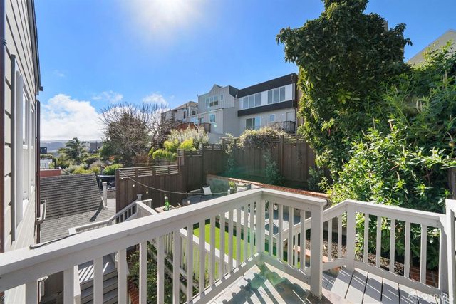 a bedroom with a bed and a potted plant