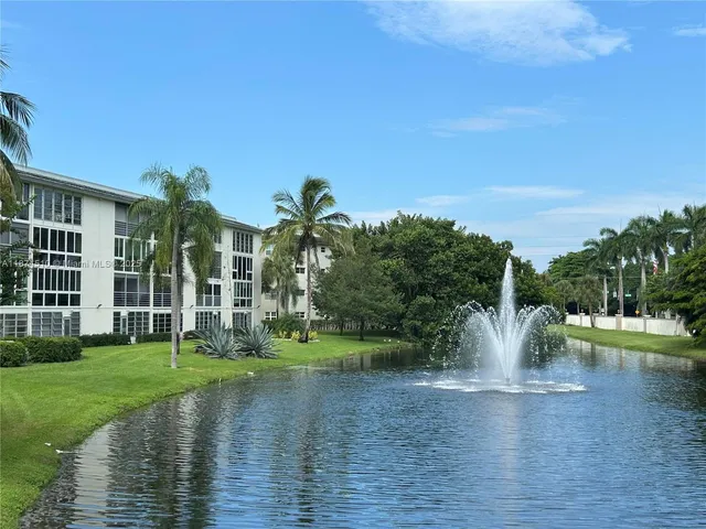 a view of a playground with a lake view