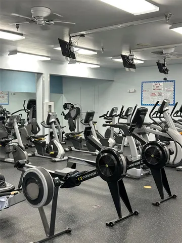 a swimming pool with outdoor seating yard and furniture