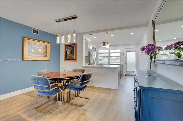 a dining room with furniture and wooden floor