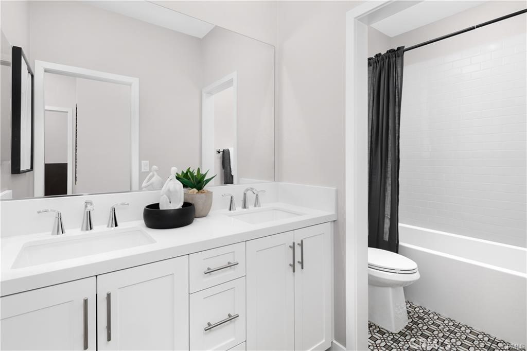 242 Solaro Court Walnut, CA 91789 - Photo 13 of 15 a bathroom with a sink a toilet and a large mirror